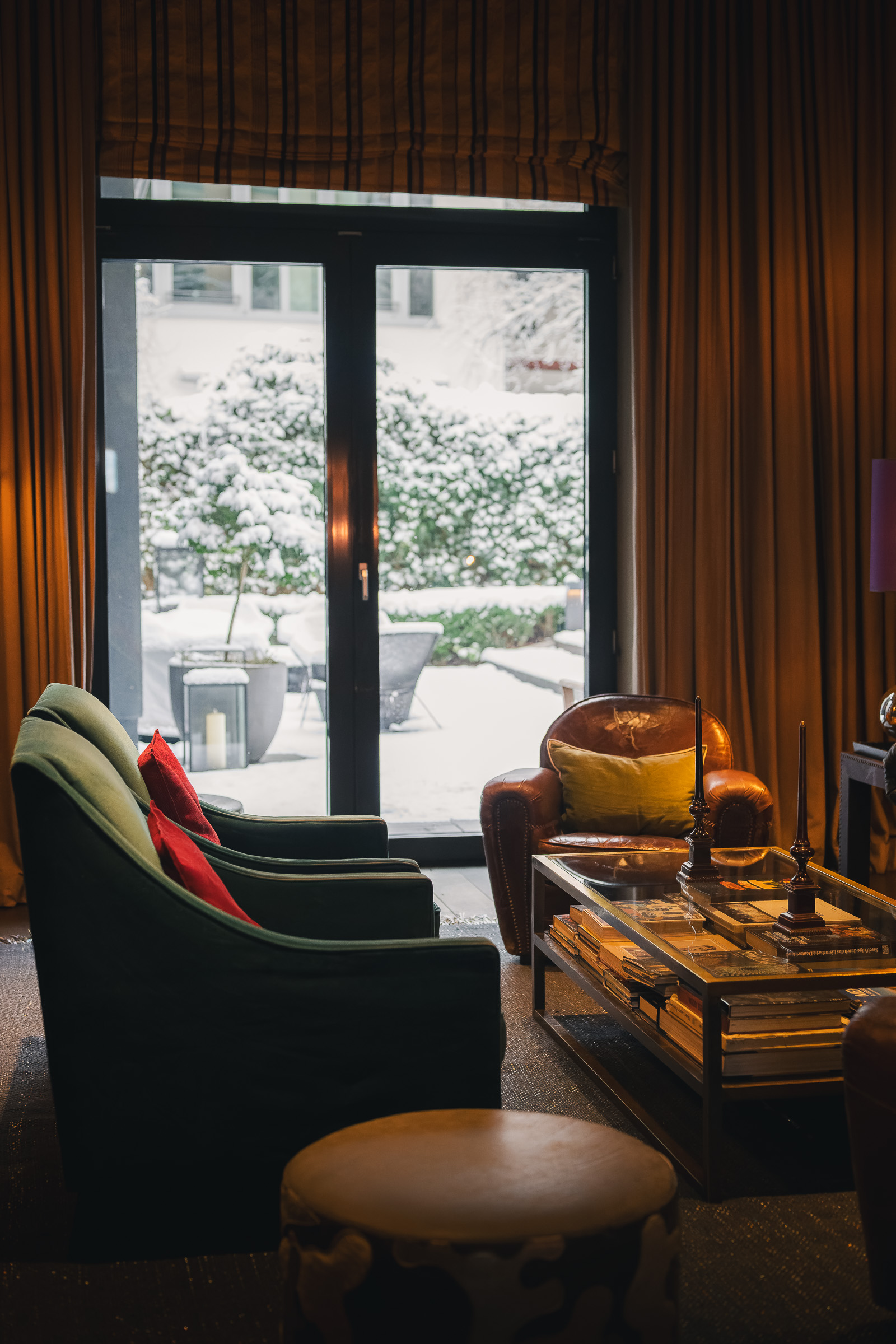 Cozy lounge seating beside the garden doors at The George Hamburg