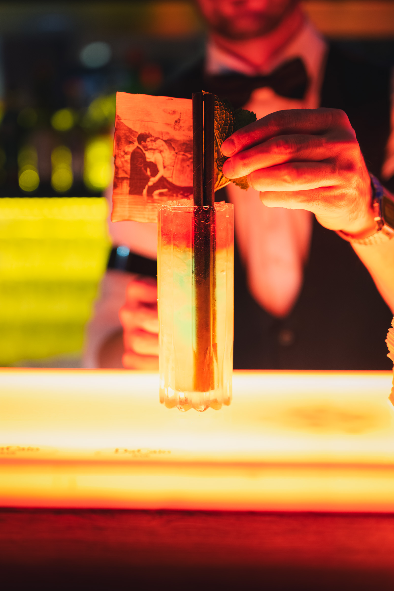 Bartender stirring a tall cocktail at the DaCaio Bar