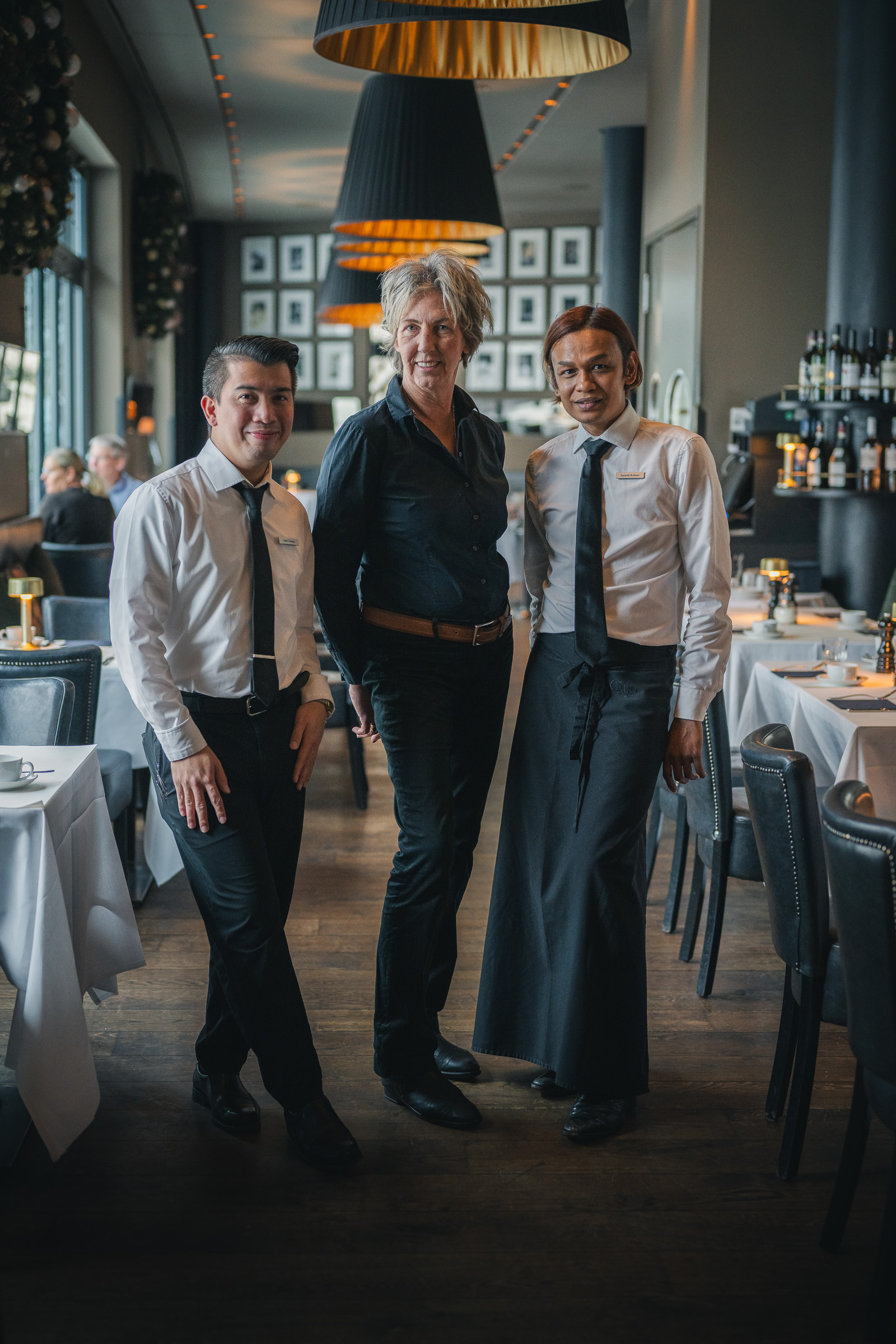 Three members of the restaurant team standing together at The George
