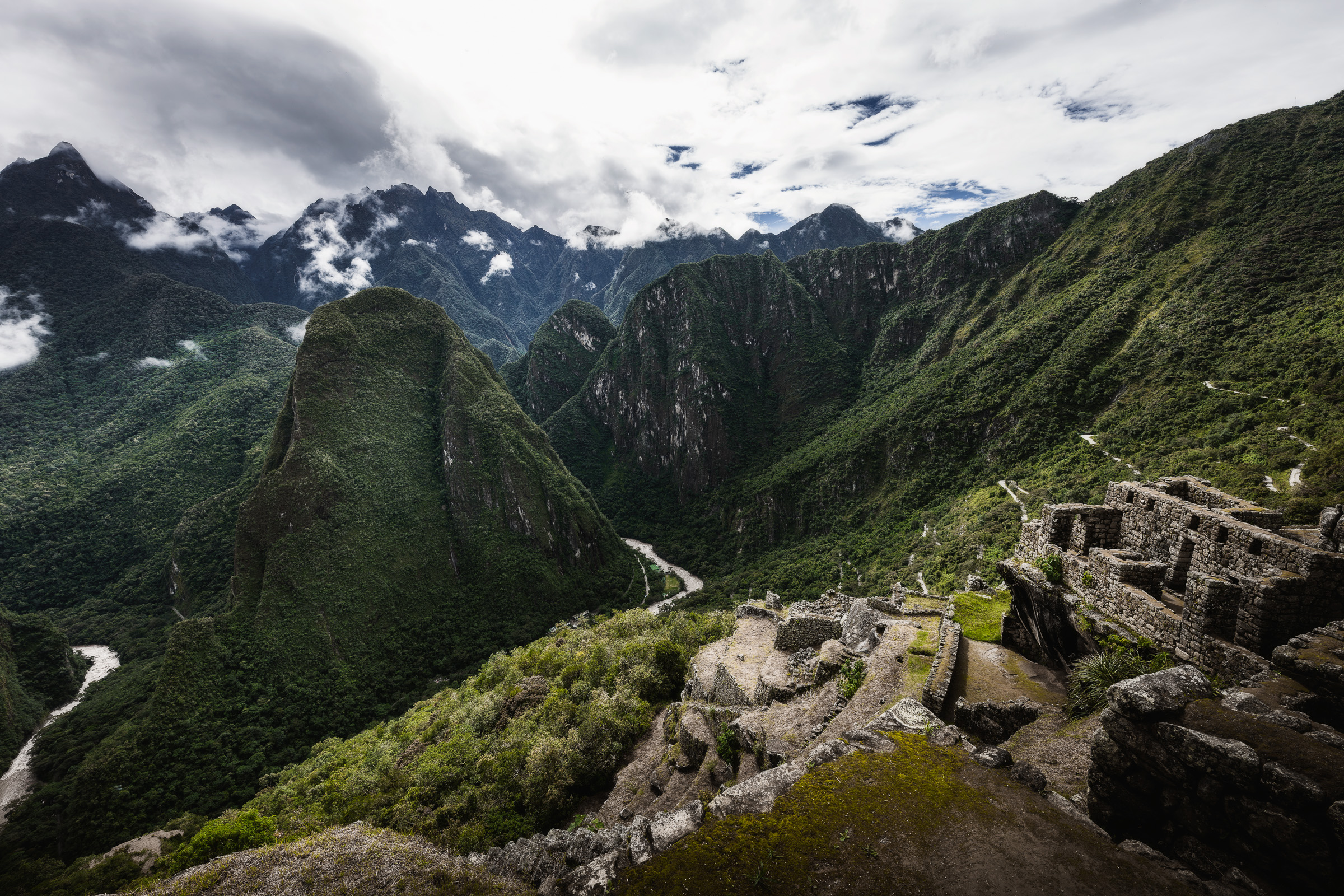 Machu Picchu ruins overlooking a winding river in the Andes