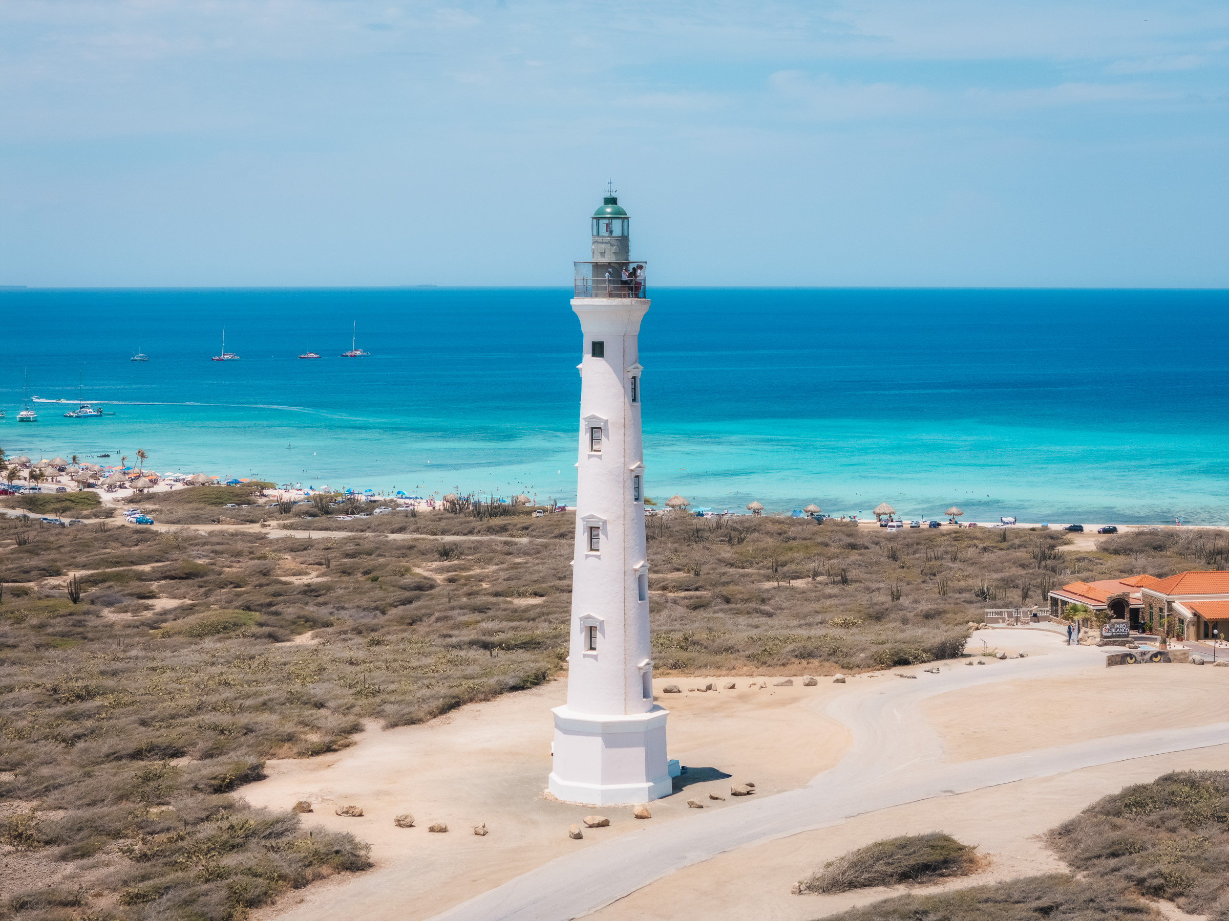 California Lighthouse rising above Aruba's turquoise coastline