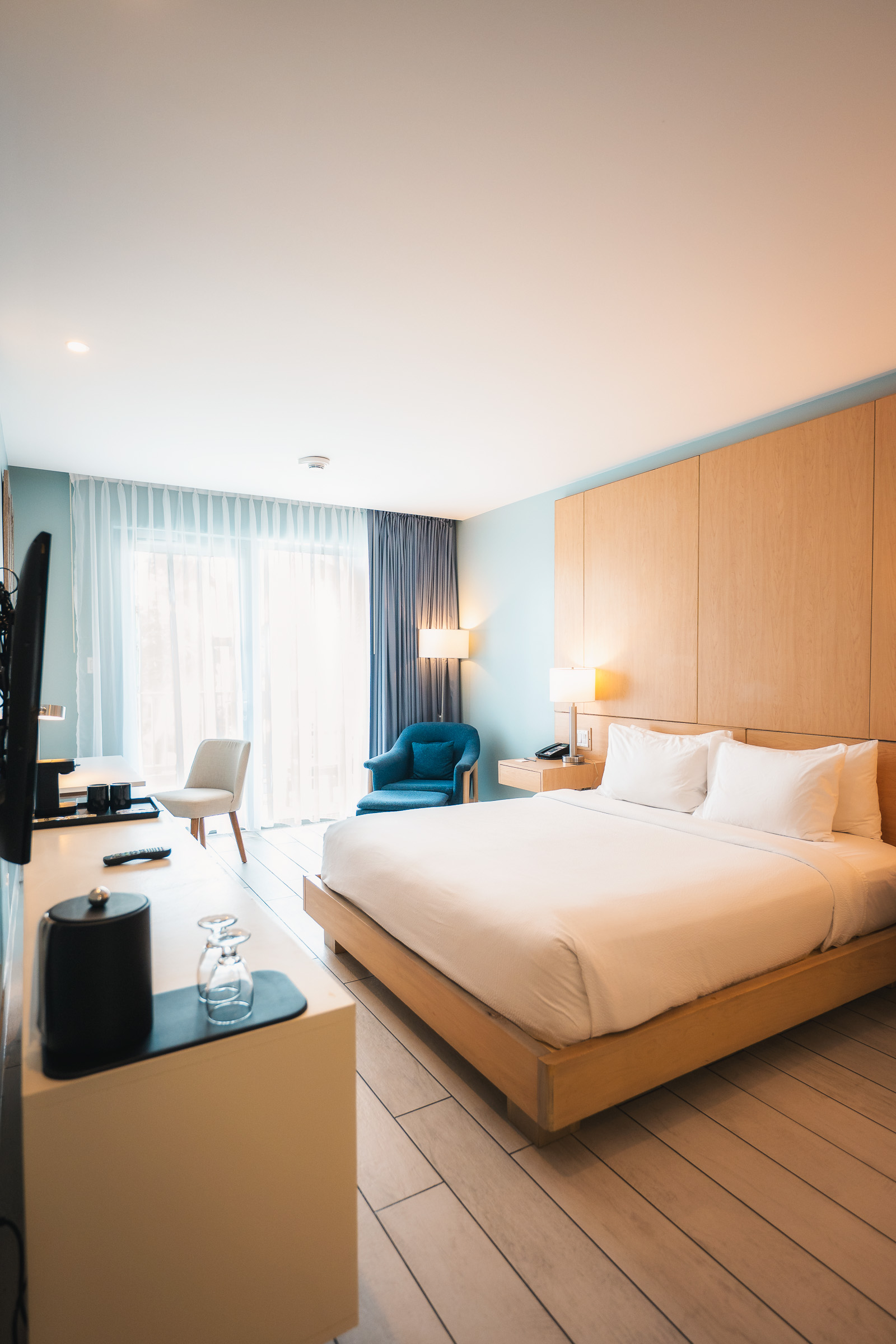 Spacious Courtyard Aruba guest room with warm wood paneling