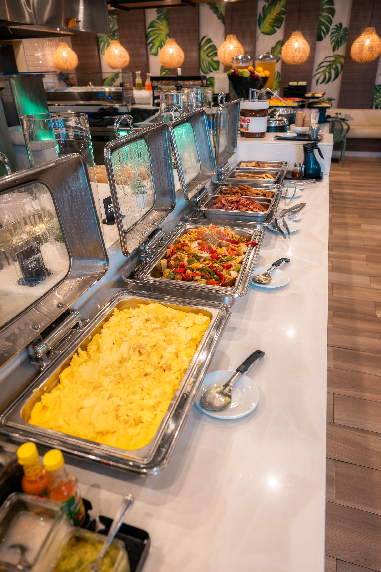 Hot breakfast dishes arranged along the Courtyard Aruba buffet