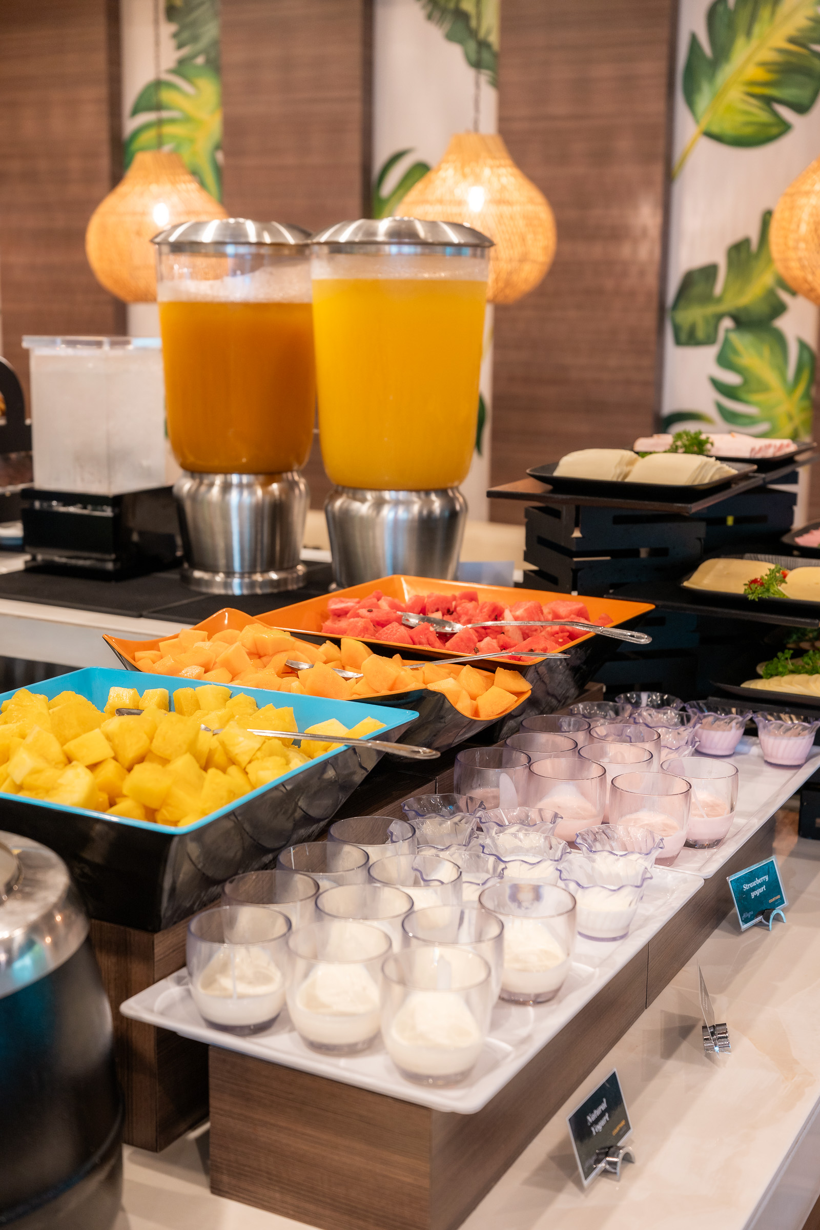 Fruit, yogurt and juice station at the hotel breakfast buffet