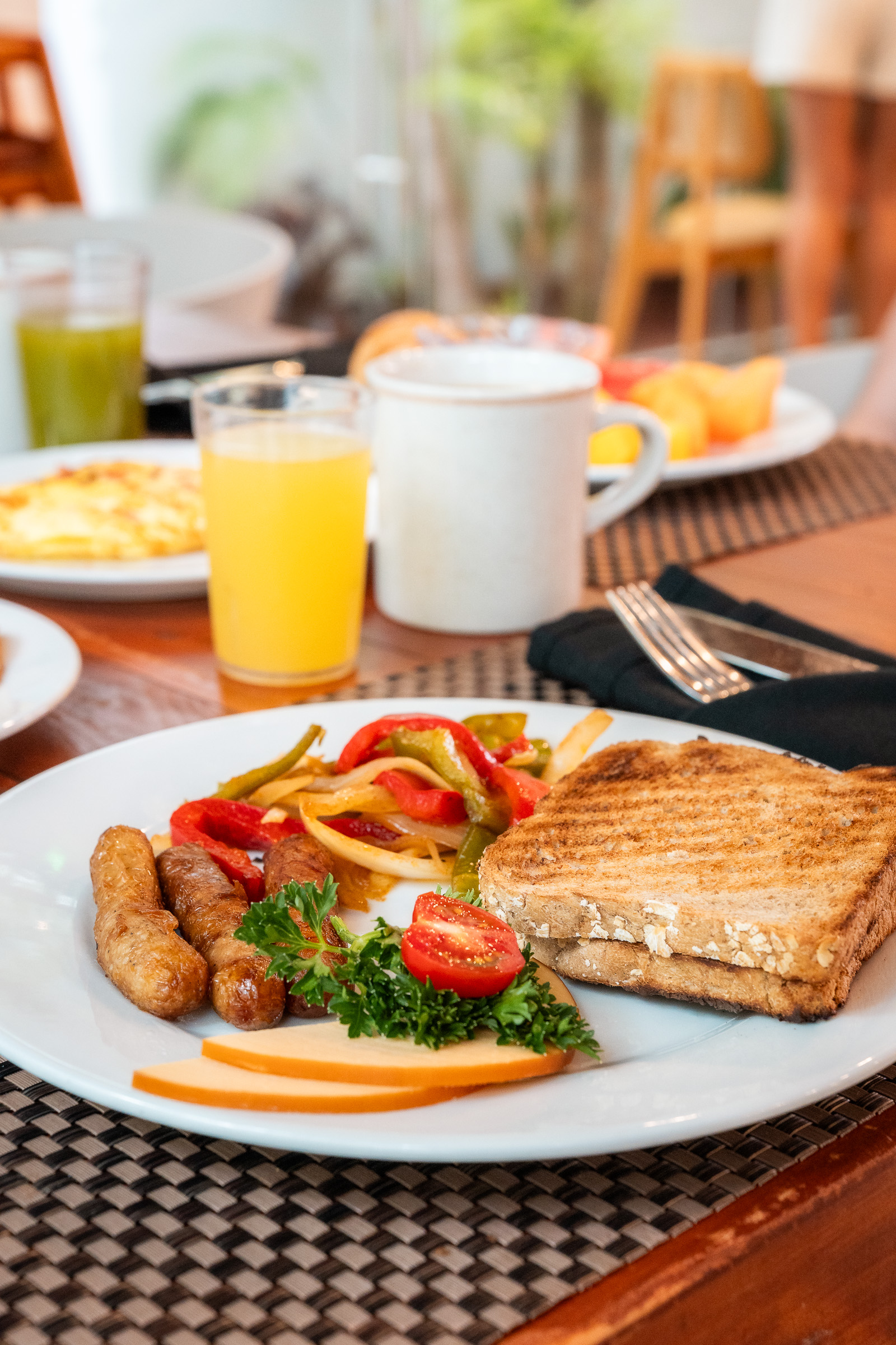 Freshly prepared breakfast plate with toast, eggs and vegetables