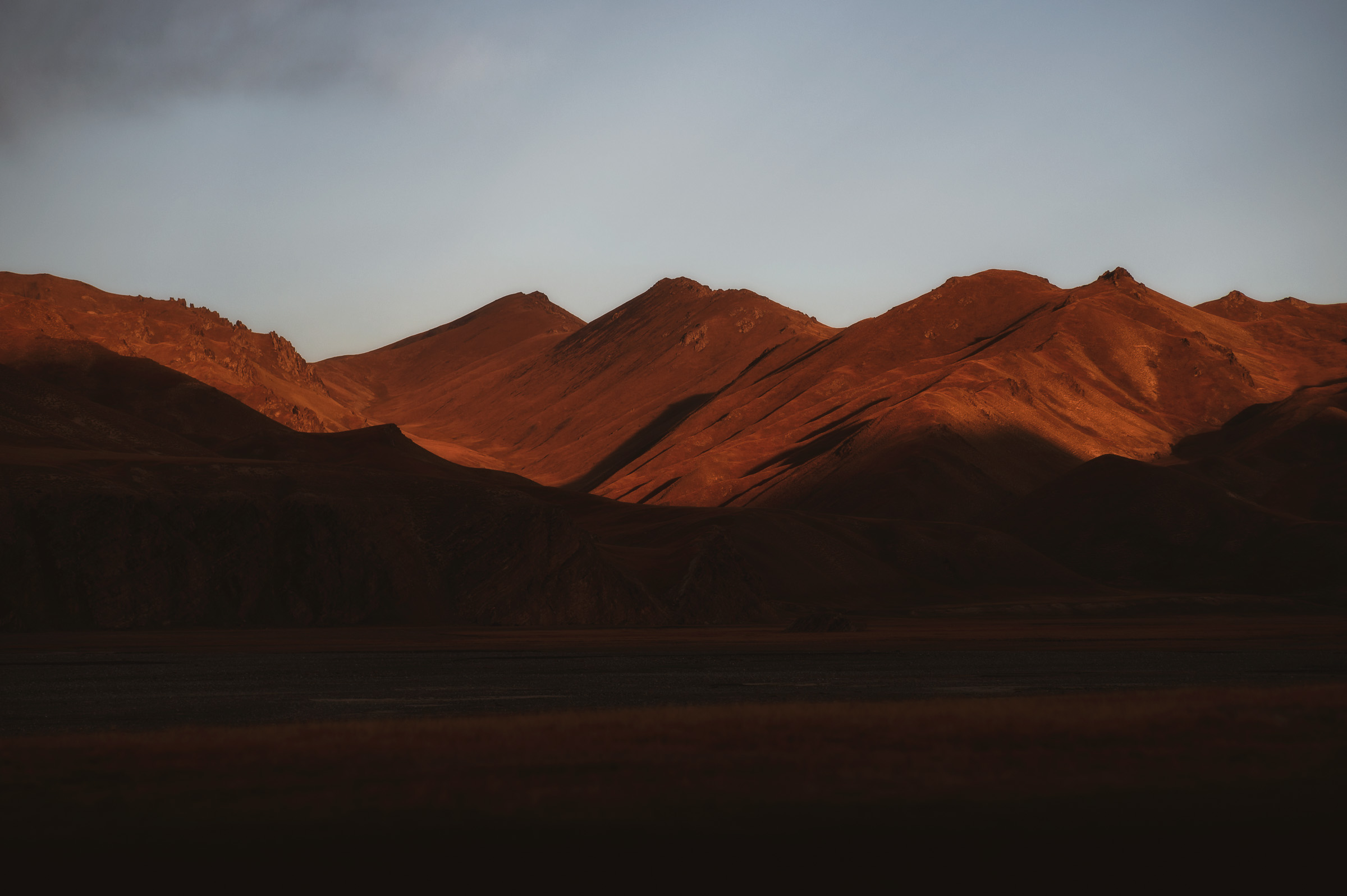 Red mountain range glowing after sunset