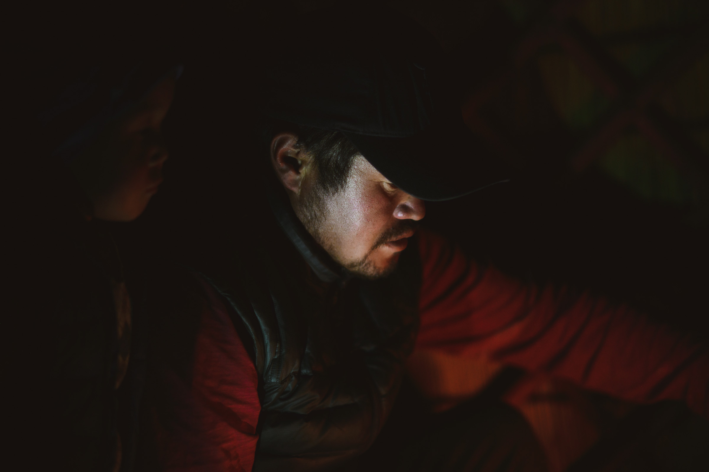 Traveler illuminated inside a dark tent