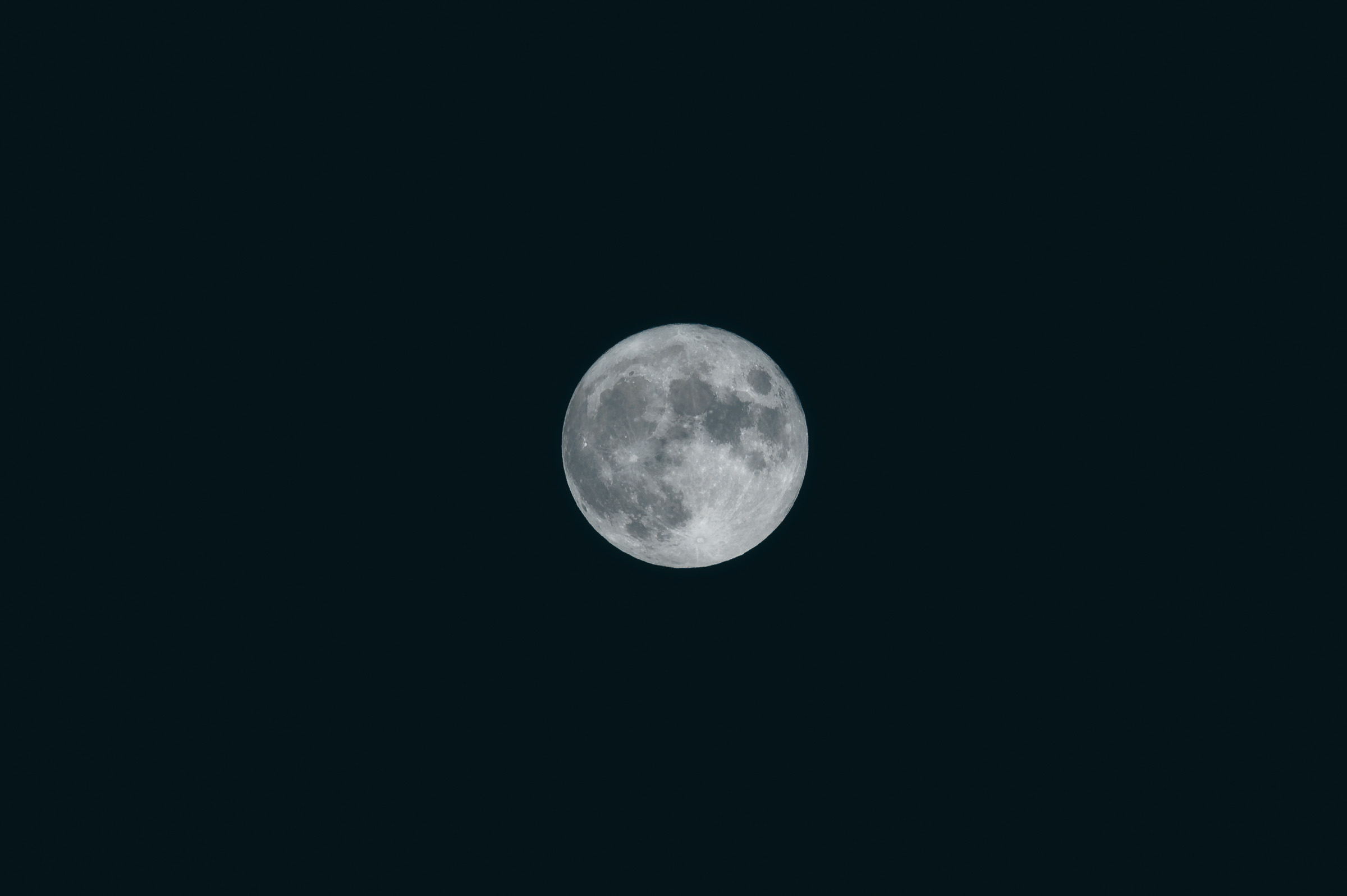 Detailed full moon against a black night sky