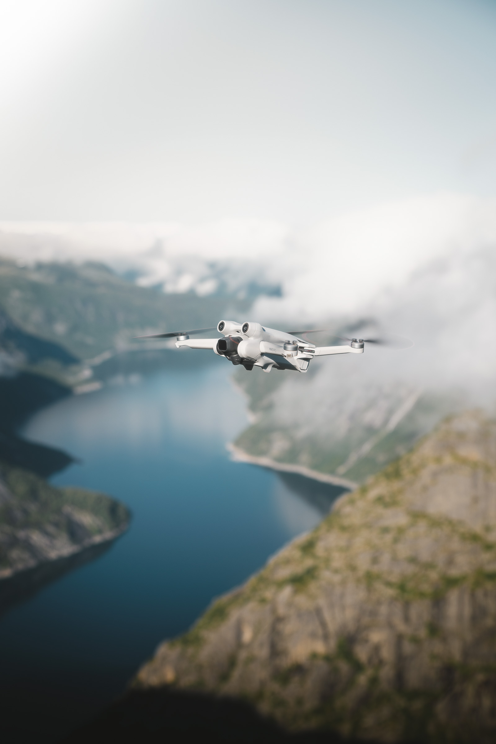 Camera drone flying above a mountain lake in Norway