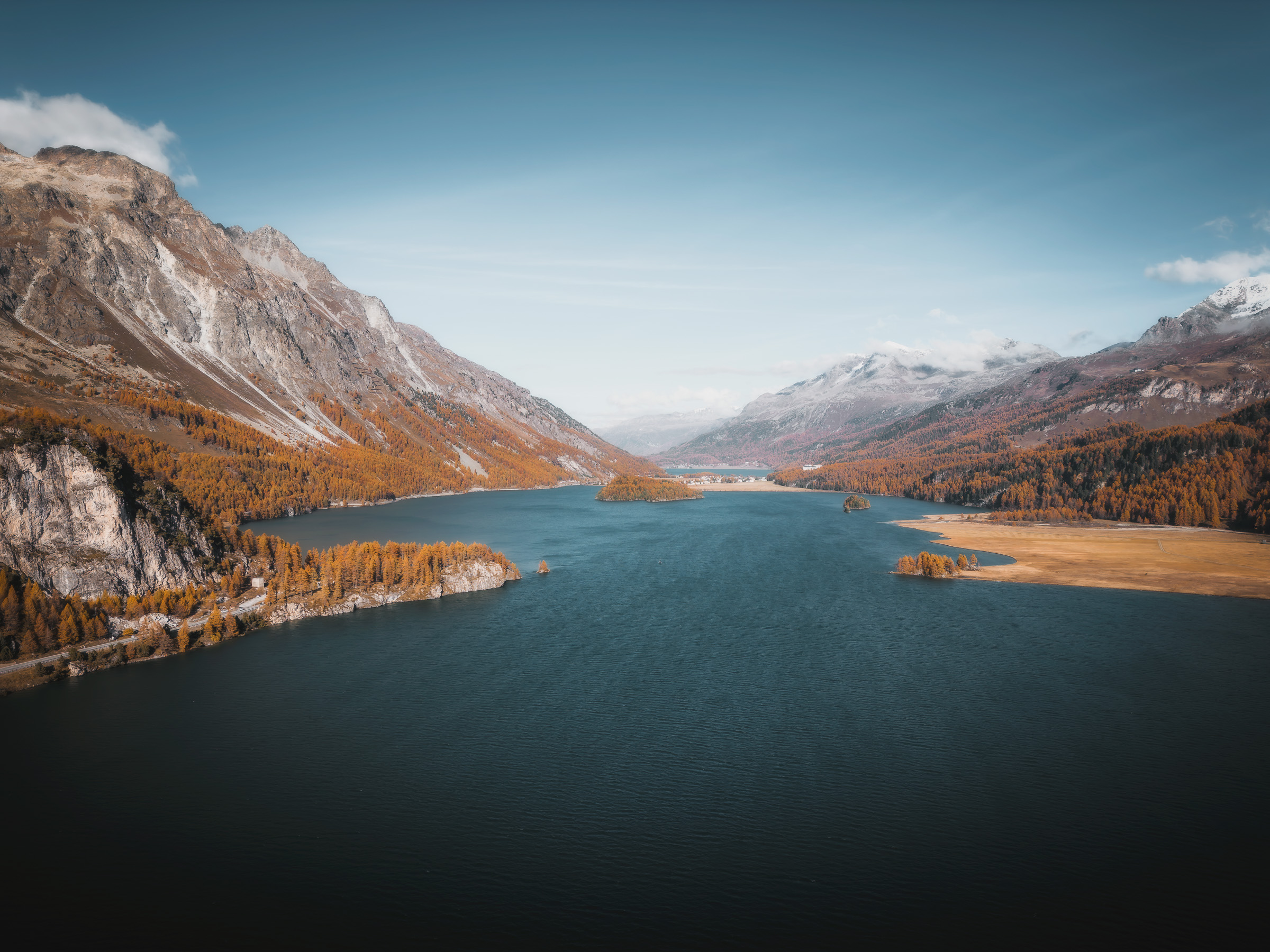 Panoramic view across Lake Sils and the autumn Engadin valley