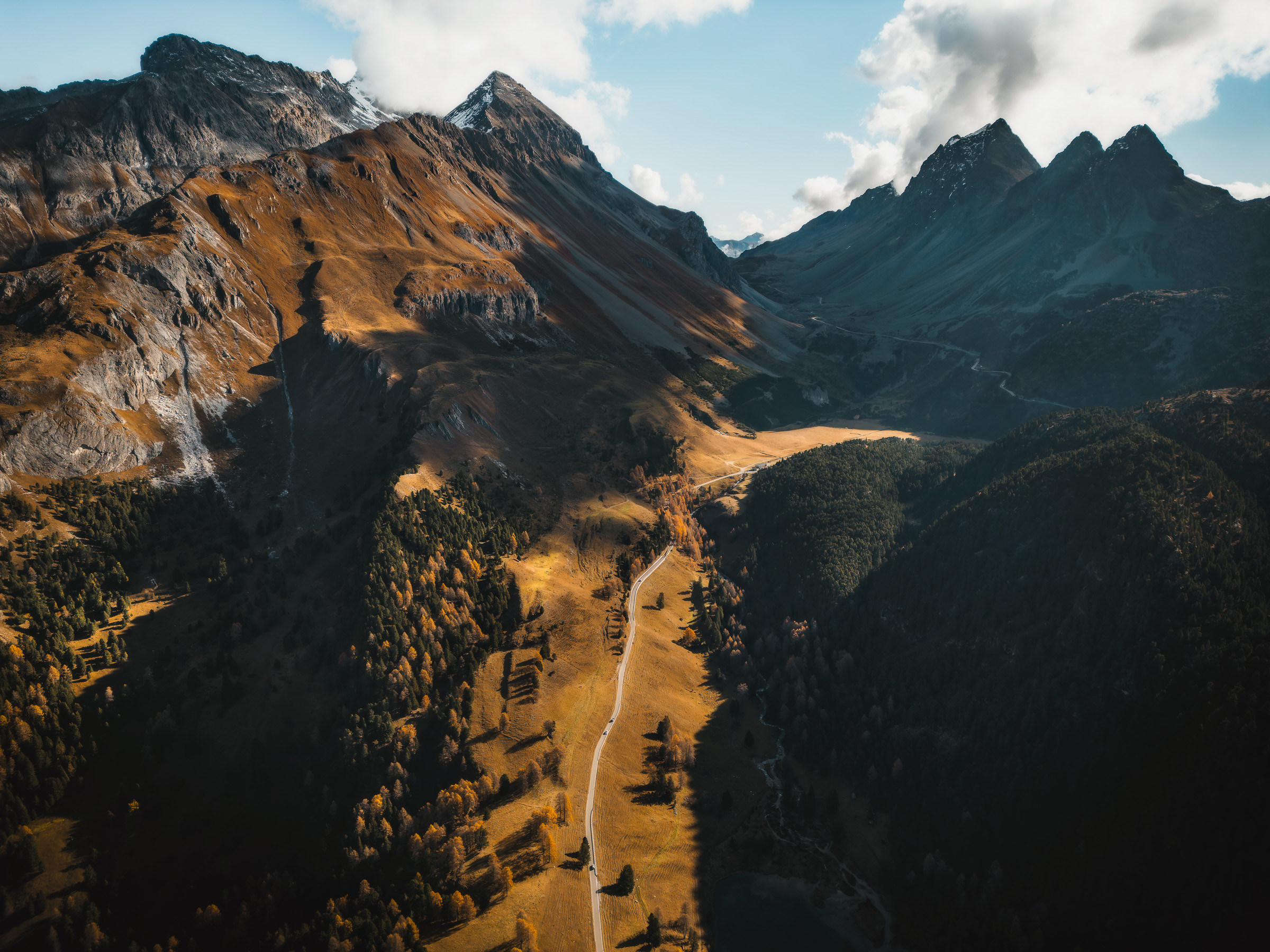 Aerial view of rugged alpine ridges in warm evening light