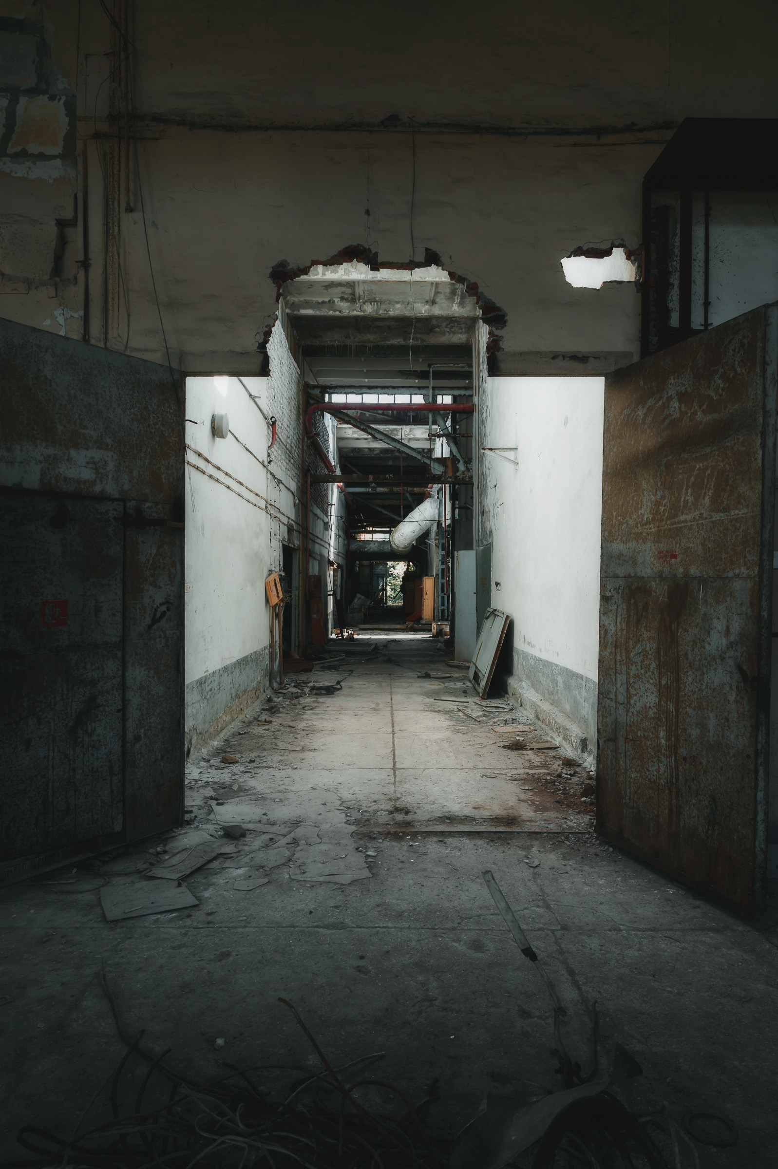 Decaying corridor inside an abandoned public building