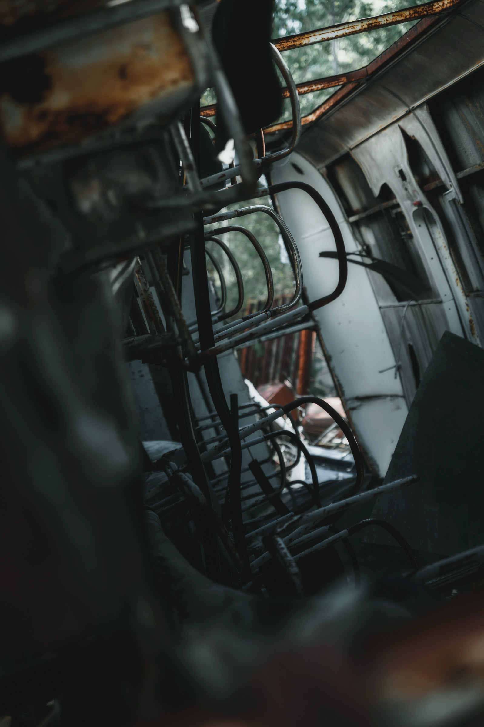 Close-up of rusted machinery and tangled cables