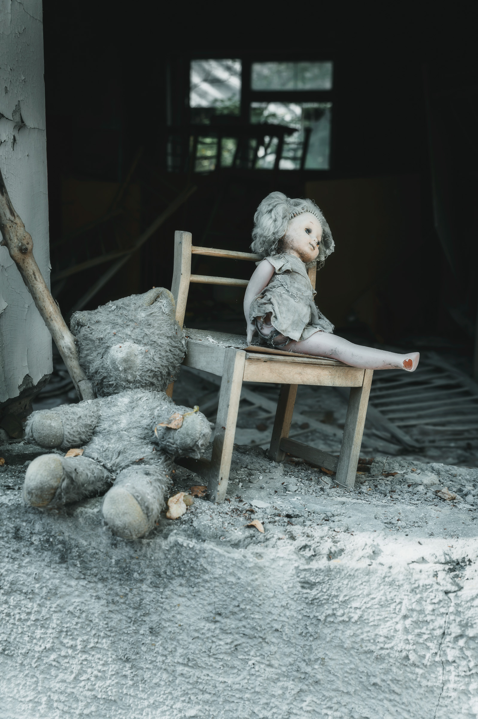 Dolls arranged inside an abandoned kindergarten