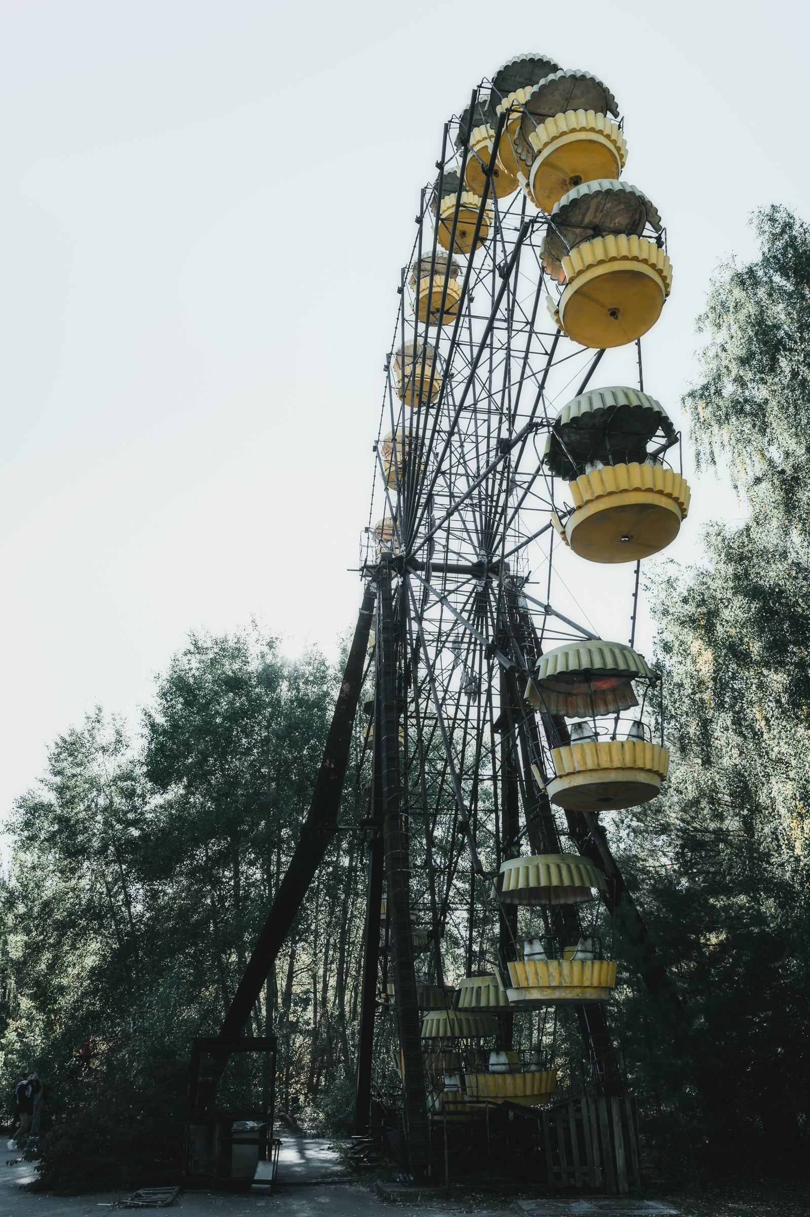 Abandoned Pripyat Ferris wheel rising above the trees