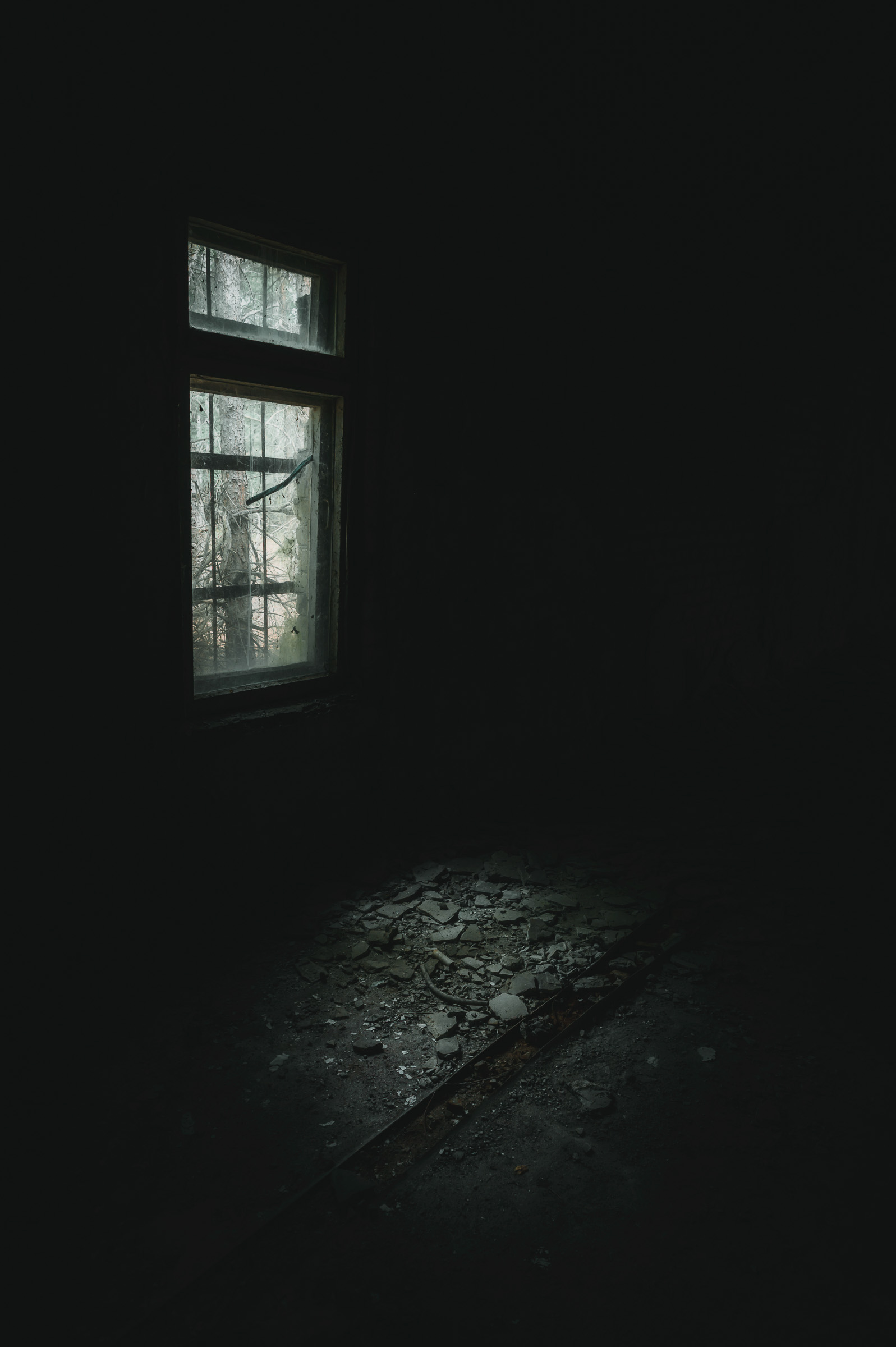 Shaft of light entering a dark abandoned room