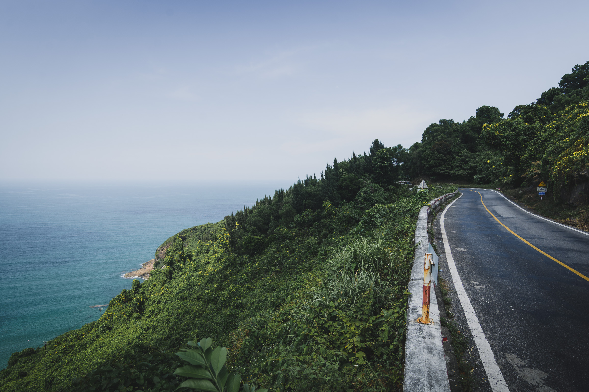 Coastal mountain road overlooking the blue sea in Vietnam