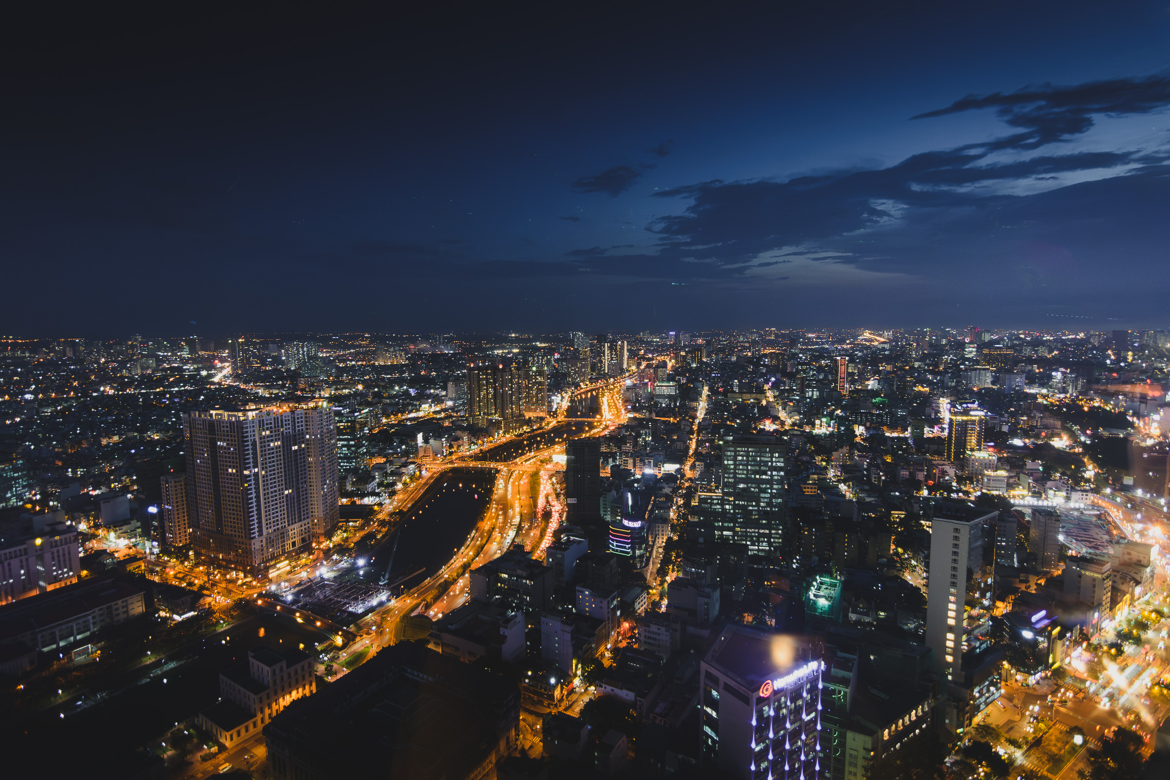 Illuminated streets of Ho Chi Minh City seen from above at night